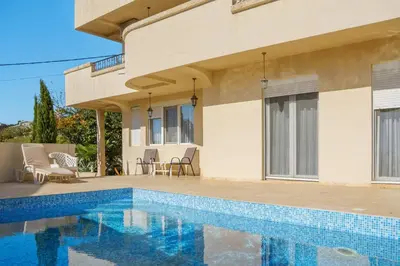a house with a swimming pool in front of it at Lemon Villa in Bar