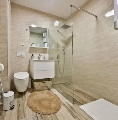 a bathroom with a shower and a toilet and a sink at Your Sunny vacation in Budva