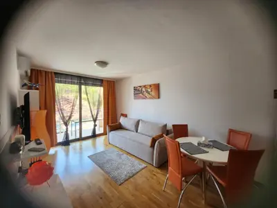 a living room with a couch and a table at 1-Bedroom Appartament mit Pool in Pržno