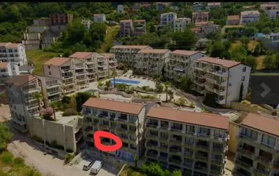 an aerial view of an apartment complex with a red circle at 1-Bedroom Appartament mit Pool in Pržno
