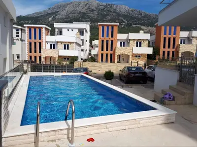 a swimming pool in the middle of a building at SeaCharm in Dobra Voda