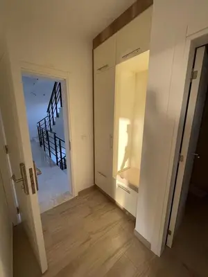 a room with a hallway with a door and a staircase at SeaCharm in Dobra Voda