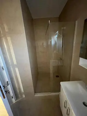 a bathroom with a shower and a toilet and a sink at SeaCharm in Dobra Voda