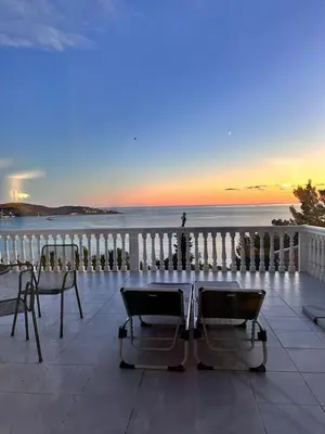 a balcony with chairs and a view of the ocean at Villa Luna Blue in Brca