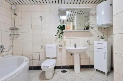 a bathroom with a toilet and a sink and a tub at Montesan Luxury Apartments Sveti Stefan in Sveti Stefan