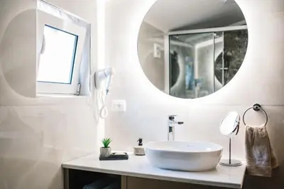 a bathroom with a sink and a mirror at Villa Oleander in Ulcinj