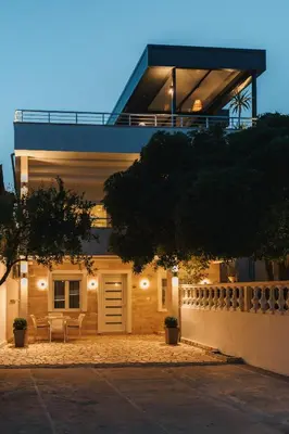 a house with a fence in front of it at Villa Oleander in Ulcinj