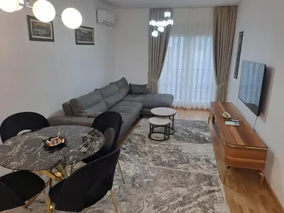 a living room with a couch and a table at Apartman Vlado Podgorica in Podgorica