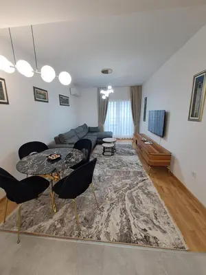 a living room with a couch and a table at Apartman Vlado Podgorica in Podgorica