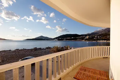 a balcony with a view of the water at Sea view Apartments Rafailovici in Budva