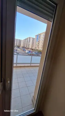 a sliding glass door with a view of a balcony at Apartment Katarina in Podgorica