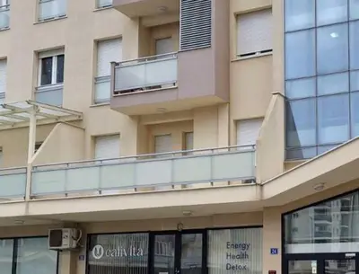 a building with a balcony on the side of it at Apartment Katarina in Podgorica