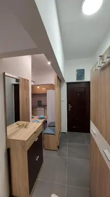 a bathroom with a counter and a sink in a room at DMD Apartman in Podgorica
