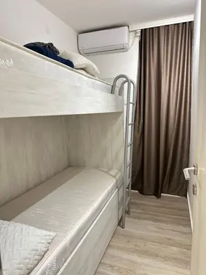 a room with two bunk beds and a window at Apartman Vesna Budva 2 in Lugovi