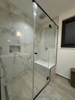 a bathroom with a shower with a glass door at Exclusive villa Kaza - Przno in Budva