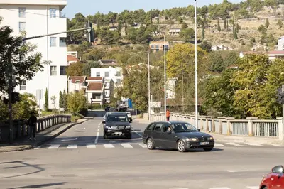 a group of cars driving down a street at Anika apartment in Podgorica