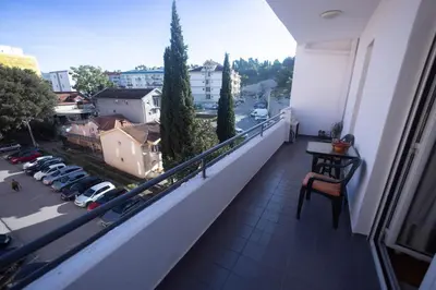 a balcony with a view of a parking lot at Anika apartment in Podgorica