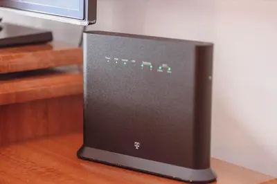 a computer monitor sitting on top of a wooden table at Anika apartment in Podgorica