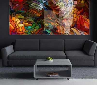 a living room with a couch and a colorful painting at Kuca Ljepa in Zoganj