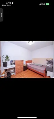 a room with a bed and a desk and a bed sidx sidx sidx at Kuca Ljepa in Zoganj