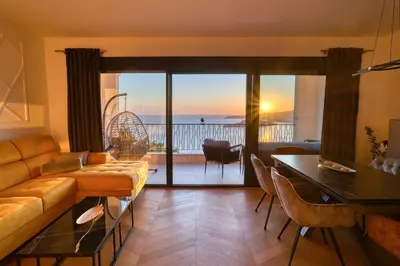 a living room with a couch and a table at Magic view - Apartment with Pool in Budva