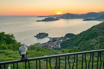 a view of the ocean from a balcony at Magic view - Apartment with Pool in Budva