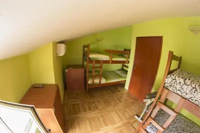 a room with three bunk beds in a room at Explorer Podgorica in Podgorica