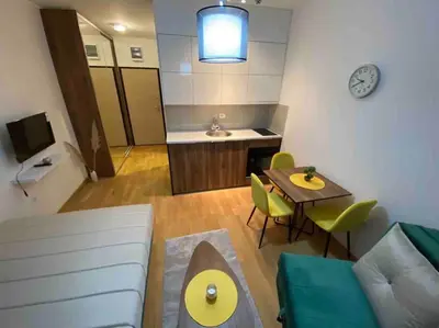 a living room with a couch and a table at Dream 1 apartment in Budva