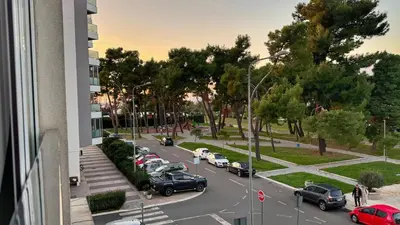 a view of a street with cars parked in a parking lot at Incanto Adriatiko in Bar