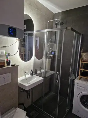 a bathroom with a shower and a sink at Rosemary in Podgorica