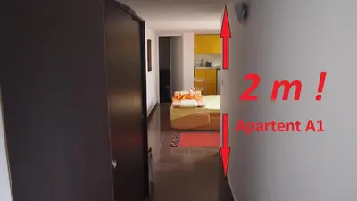 a room with a door and a bedroom with a bed at Marko Apartment in Sutomore