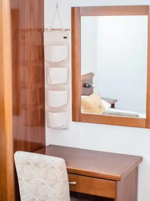 a bathroom with a desk with a mirror and a chair at Apartments Bonita in Ulcinj