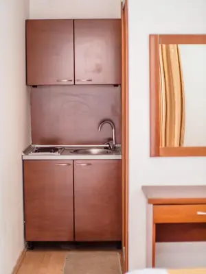 a kitchen with a sink and a stove at Apartments Bonita in Ulcinj