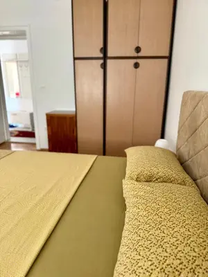a bedroom with a bed and a closet at Center Oasis Retreat in Podgorica