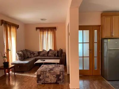 a living room with a couch and a table at Private house in the Capital City of Montenegro in Podgorica