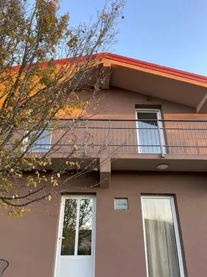 a house with a balcony on top of it at Private house in the Capital City of Montenegro in Podgorica