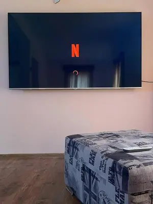 a flat screen tv hanging on a wall at Private house in the Capital City of Montenegro in Podgorica