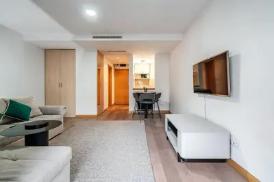 a living room with a couch and a table at Status-M Apartments Nexsan1 in Budva