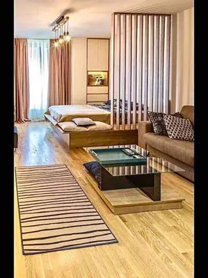 a living room with a couch and a table at Studio 38 - Modern Studio in Budva in Budva
