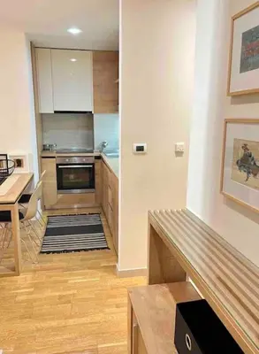 a kitchen with a table and a counter top at Studio 38 - Modern Studio in Budva in Budva