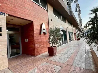 a building with a sign on the side of it at Studio 38 - Modern Studio in Budva in Budva