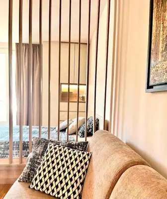 a living room with a couch and a window at Studio 38 - Modern Studio in Budva in Budva