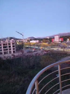 a view of a city from a balcony at Apartment near hospital Podgorica in Podgorica