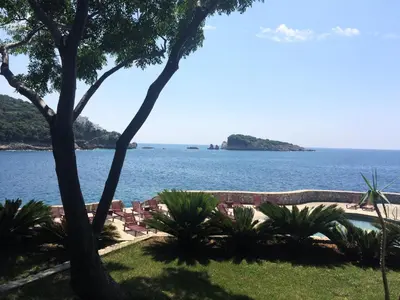 a view of the ocean from a resort at Apartment Cats in Utjeha