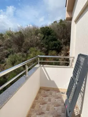 a balcony of a building with a view of a hill at Status-M Apartments Seoce 26 in Budva