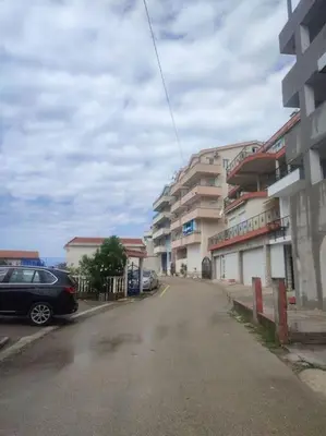 a car parked on a street next to a building at Status-M Apartments Seoce 26 in Budva