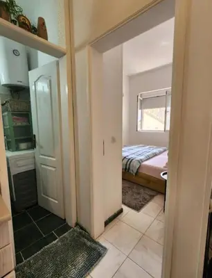 a room with a door leading to a bedroom at Apartments Ksenija in Kotor