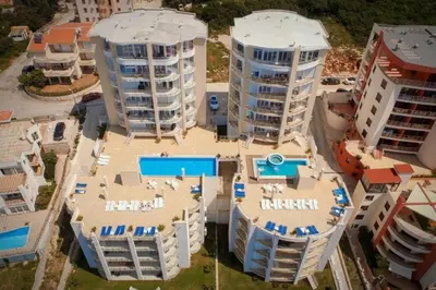 an aerial view of a building with two towers at Sky Fort Apartment in Dobra Voda