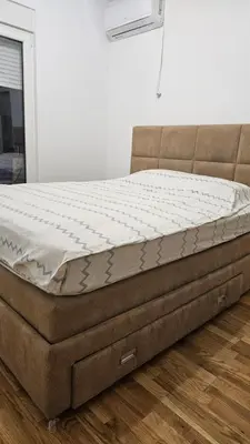 a mattress sitting on a bed frame in a room at Lamela B in Podgorica