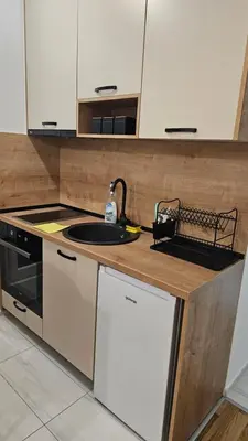 a kitchen with a sink and a counter at Lamela B in Podgorica
